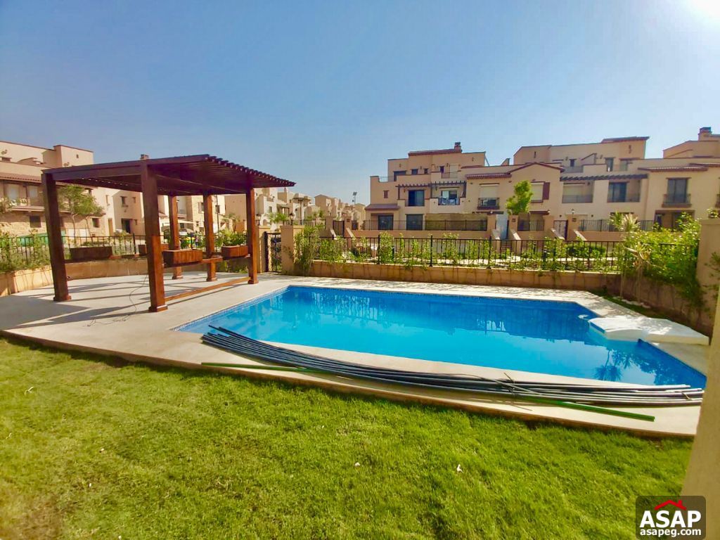 Town House with Swimming Pool for Rent in Mivida Compound Town House with Swimming Pool for Rent in Mivida Compound