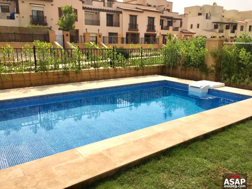 Town House with Swimming Pool for Rent in Mivida Compound Town House with Swimming Pool for Rent in Mivida Compound
